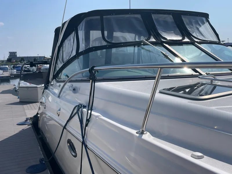 Slide: The Image of 2007 Chaparral 330 Signature boat docked at a marina. - 8