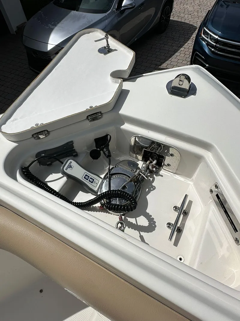 Slide: The Image of 2018 Sailfish 270 CC boat interior with seating and table, showcasing spacious design. - 24