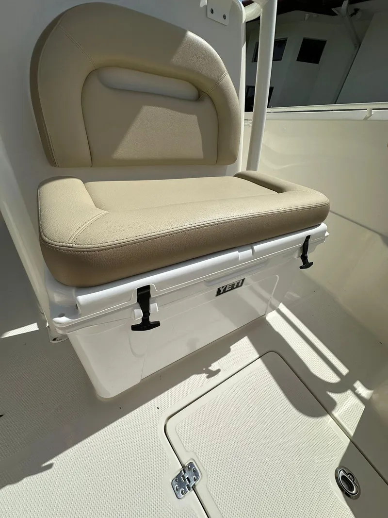 Slide: The Image of 2018 Sailfish 270 CC boat console with Garmin navigation system and steering wheel. - 26