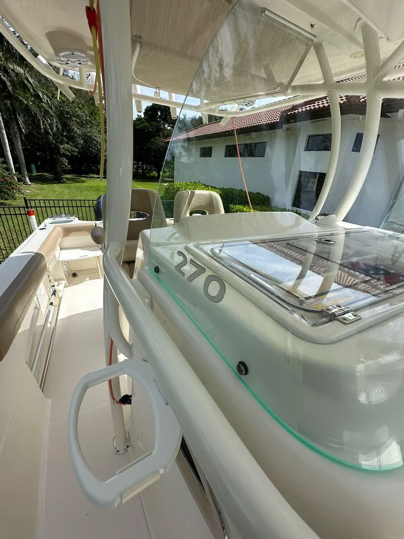Slide: The Image of 2018 Sailfish 270 CC boat anchor compartment with winch and control panel. - 27