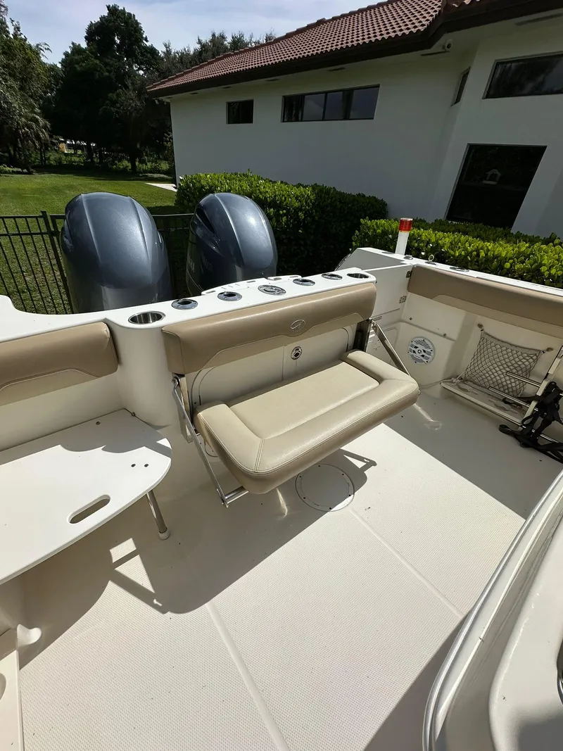 Slide: The Image of 2018 Sailfish 270 CC boat with dual outboard motors and Florida license plate. - 7