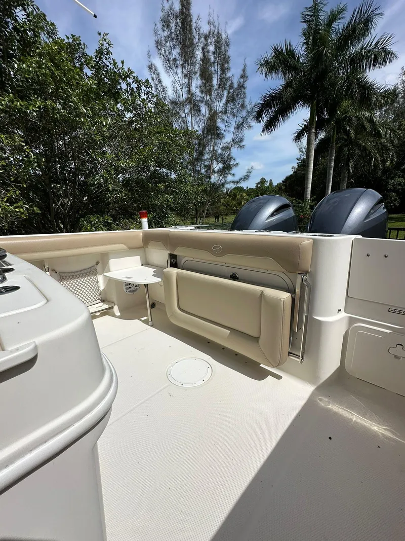 Slide: The Image of Twin Yamaha outboard motors on a 2018 Sailfish 270 CC boat, sunny day background. - 8