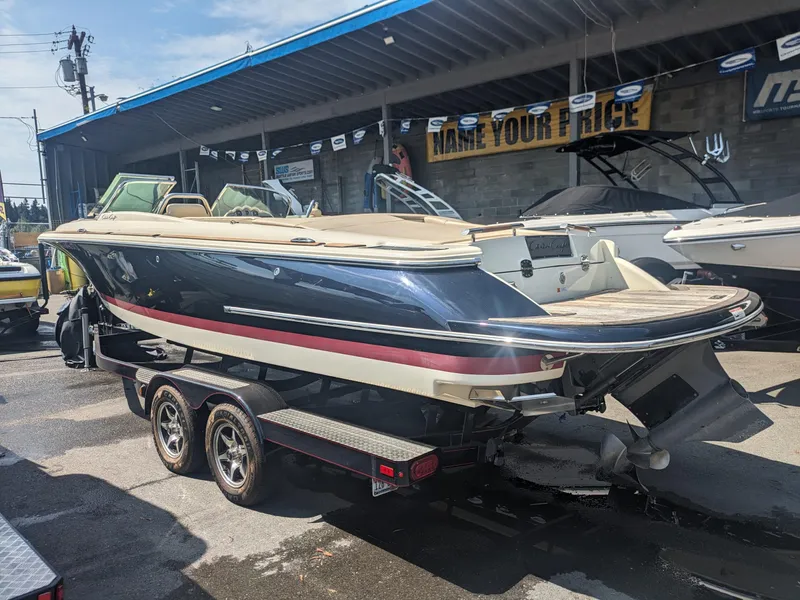 The Image of 2018 Chris-Craft Launch 27 boat on trailer at dealership. - 0