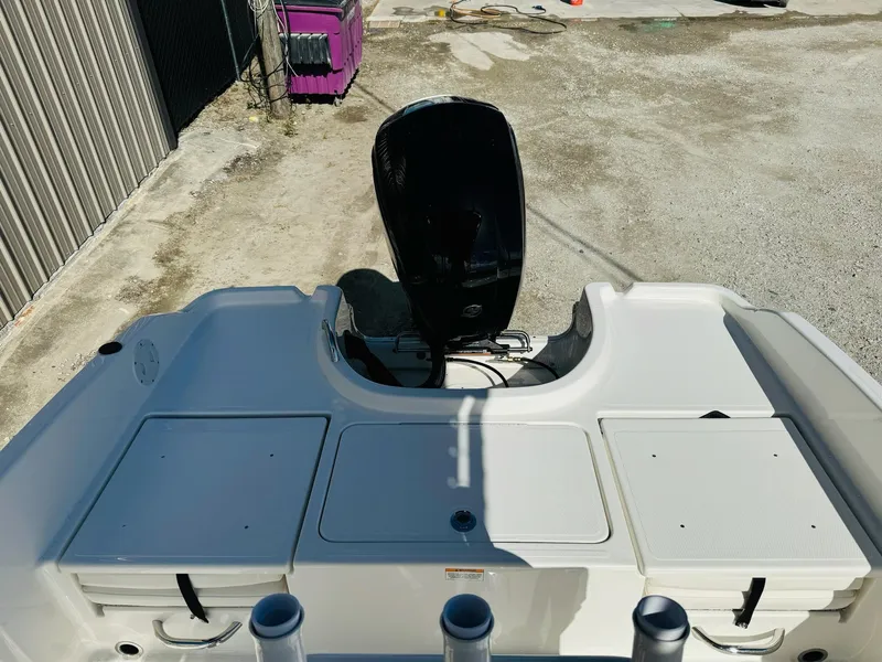 Slide: The Image of 2025 Bayliner Trophy T18 boat with outboard motor, viewed from the rear. - 3