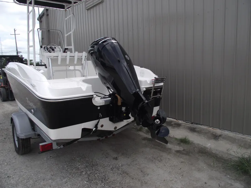 Slide: The Image of 2025 Bayliner Trophy T18 boat with outboard motor on trailer. - 4