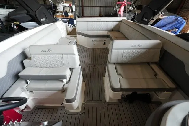 Slide: The Image of 2022 Sea Ray SDX 270 boat interior with spacious seating and elegant design. - 11