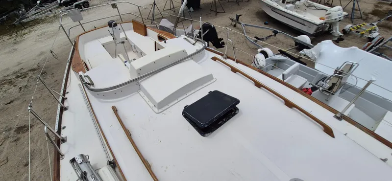 Slide: The Image of 1979 Bristol 35.5 sailboat on land, showing deck and cockpit area. - 11