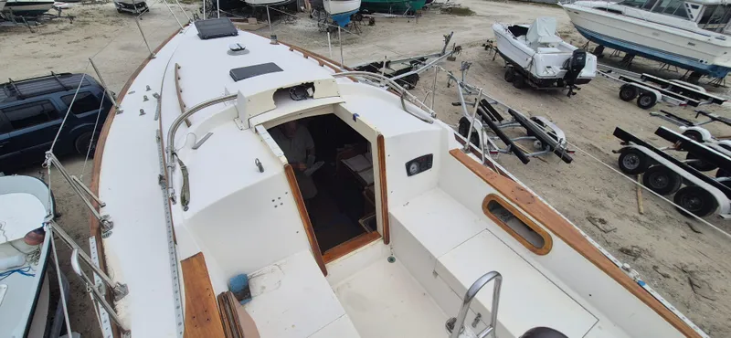 Slide: The Image of 1979 Bristol 35.5 sailboat on dry dock, showing deck and cockpit area. - 12