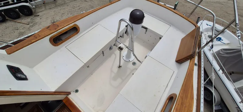 Slide: The Image of 1979 Bristol 35.5 sailboat cockpit with wooden trim and steering pedestal. - 13
