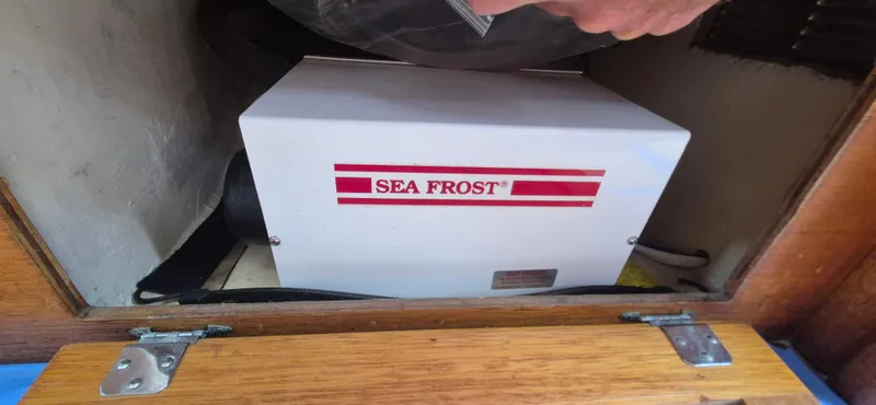 Slide: The Image of Sea Frost refrigeration unit in a 1979 Bristol 35.5 sailboat compartment. - 14