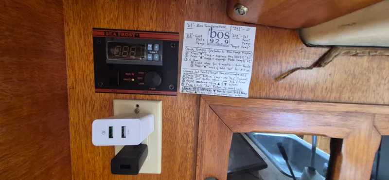 Slide: The Image of Control panel and notes inside a 1979 Bristol 35.5 boat cabin. - 8
