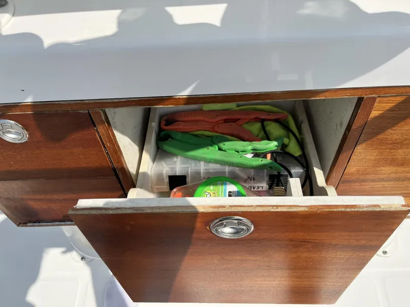 Slide: The Image of Open drawer on 2016 Regulator 23 boat with tools and supplies inside. - 19