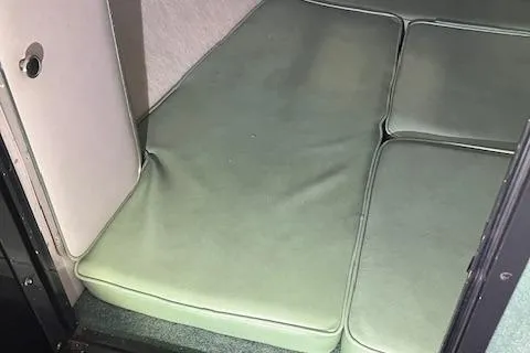 Slide: The Image of Interior cabin of 1988 Sea Ray Pachanga 22 with green cushions. - 4