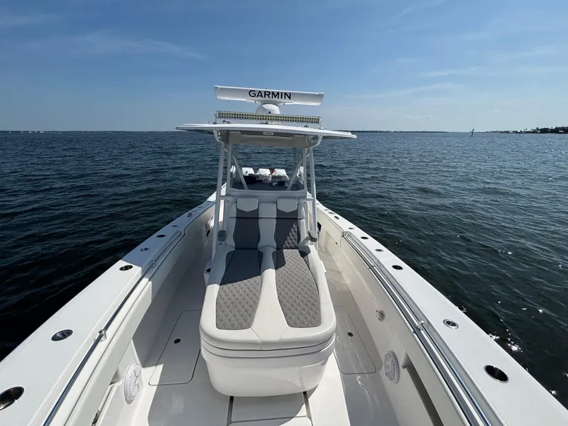 Slide: The Image of 2022 Invincible 36 Open Fisherman boat on calm ocean waters under clear blue sky. - 14