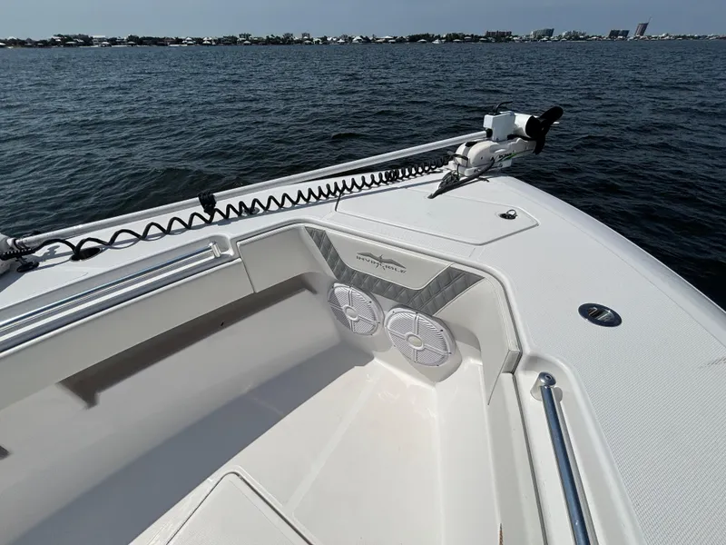 Slide: The Image of 2022 Invincible 36 Open Fisherman boat on water, featuring deck and speakers. - 15