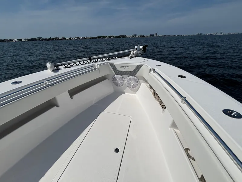 Slide: The Image of 2022 Invincible 36 Open Fisherman boat on calm waters, clear sky. - 19