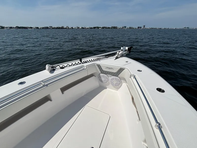 Slide: The Image of 2022 Invincible 36 Open Fisherman boat on calm water, featuring spacious deck and modern design. - 26