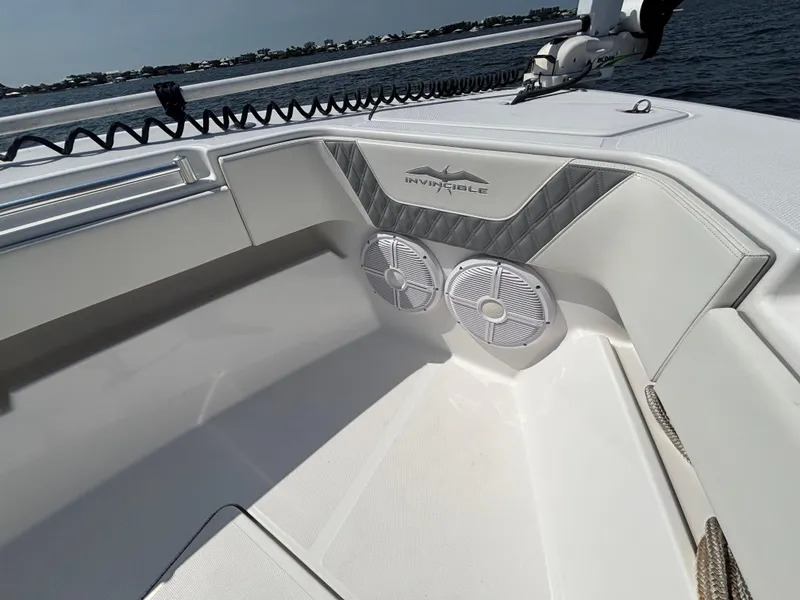 Slide: The Image of 2022 Invincible 36 Open Fisherman boat interior with speakers and sleek design. - 27