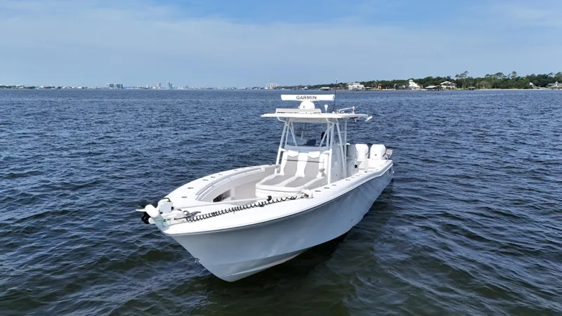 Slide: The Image of 2022 Invincible 36 Open Fisherman boat on calm waters, clear sky background. - 3