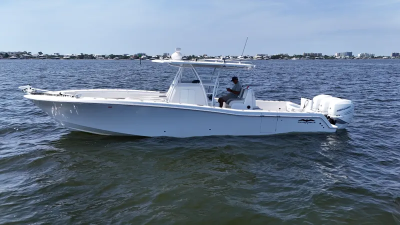 Slide: The Image of 2022 Invincible 36 Open Fisherman boat on calm water, side view. - 7