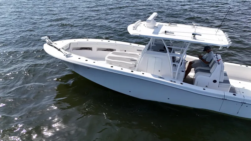 Slide: The Image of 2022 Invincible 36 Open Fisherman boat cruising on open water. - 8