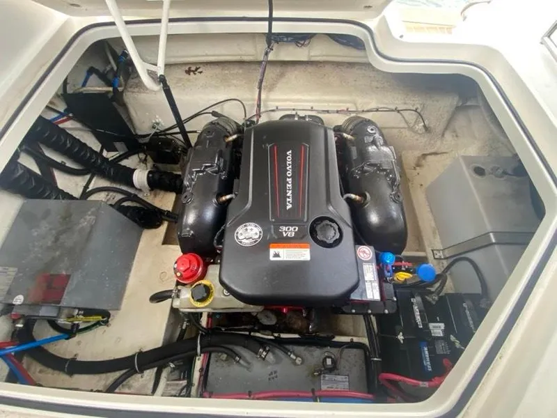 Slide: The Image of Engine compartment of a 2019 Regal 26 Express boat with Volvo Penta 300 V6 engine. - 16