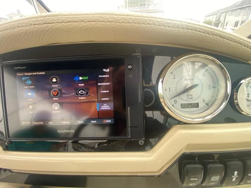 Slide: The Image of Dashboard of a 2019 Regal 26 Express boat with Garmin GPS and RPM gauge. - 9
