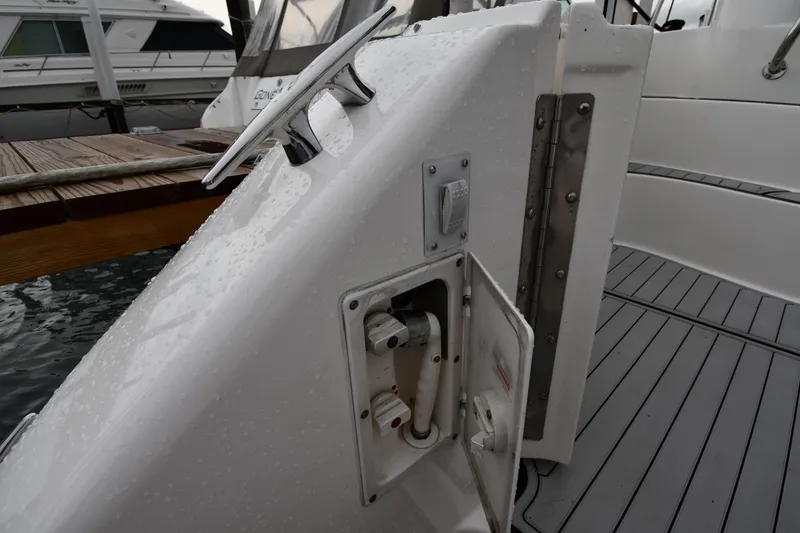 Slide: The Image of 2001 Sea Ray 480 Sedan Bridge yacht, showing deck details and dock connection. - 16