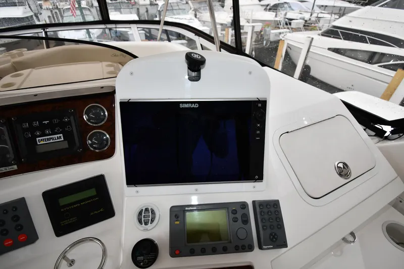 Slide: The Image of Control panel of a 2001 Sea Ray 480 Sedan Bridge yacht with navigation equipment. - 21