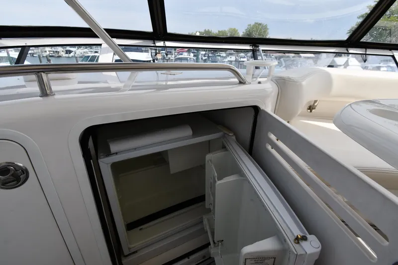 Slide: The Image of Open refrigerator on 2001 Sea Ray 480 Sedan Bridge yacht deck. - 29
