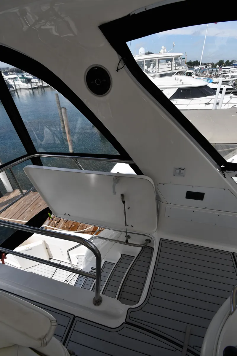 Slide: The Image of 2001 Sea Ray 480 Sedan Bridge interior with marina view. - 36