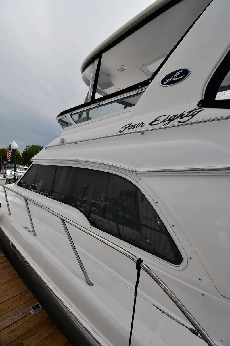 Slide: The Image of 2001 Sea Ray 480 Sedan Bridge yacht docked at marina. - 4