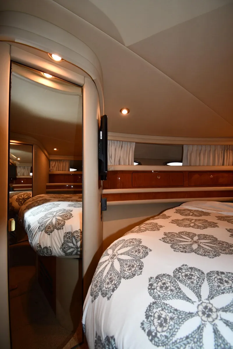 Slide: The Image of Luxurious cabin interior of 2001 Sea Ray 480 Sedan Bridge yacht with elegant bedding. - 43