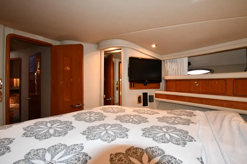 Slide: The Image of Luxurious cabin interior of 2001 Sea Ray 480 Sedan Bridge yacht with elegant bedding. - 44