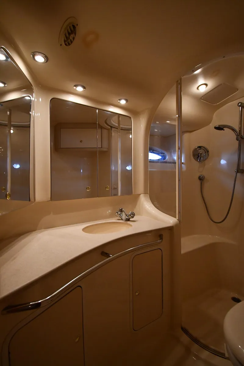 Slide: The Image of Luxurious bathroom in 2001 Sea Ray 480 Sedan Bridge yacht with modern fixtures. - 49