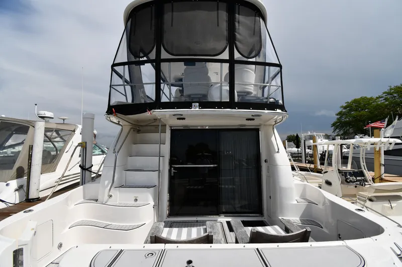 Slide: The Image of 2001 Sea Ray 480 Sedan Bridge yacht with spacious deck and enclosed upper helm. - 6