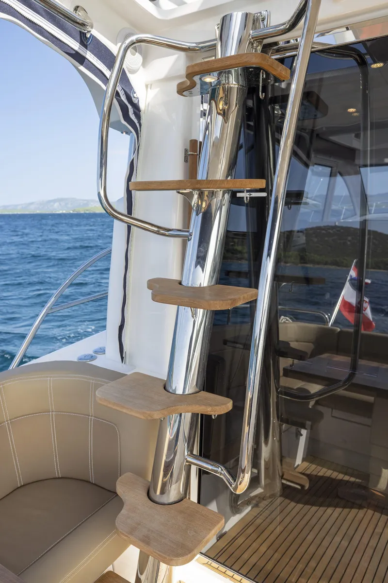Slide: The Image of Stainless steel and wood staircase on Nimbus 405 Flybridge yacht, 2025 model. - 7