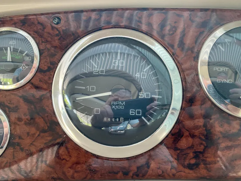 Slide: The Image of Dashboard of a 1999 Sea Ray 380 Sundancer boat with RPM gauge. - 15