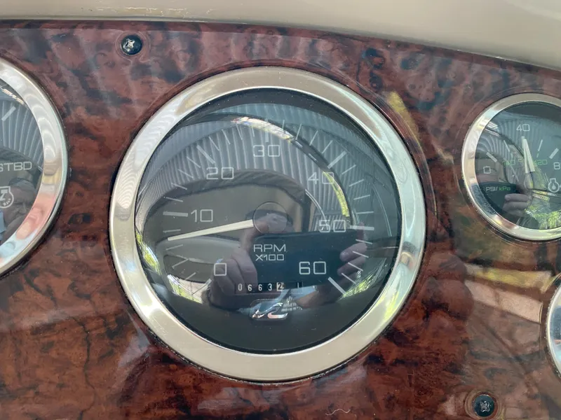 Slide: The Image of Close-up of 1999 Sea Ray 380 Sundancer RPM gauge on wood panel dashboard. - 16