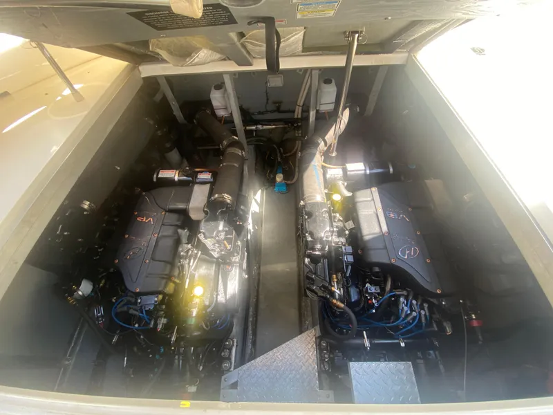 Slide: The Image of Engine compartment of a 1999 Sea Ray 380 Sundancer with dual engines visible. - 35
