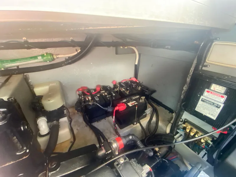 Slide: The Image of Engine compartment of a 1999 Sea Ray 380 Sundancer with batteries and wiring. - 36