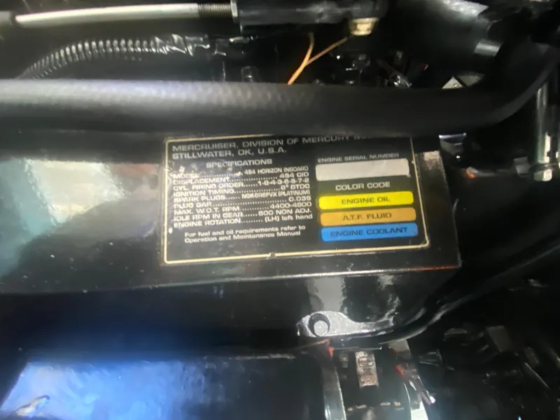 Slide: The Image of Engine specifications label on a 1999 Sea Ray 380 Sundancer boat. - 39