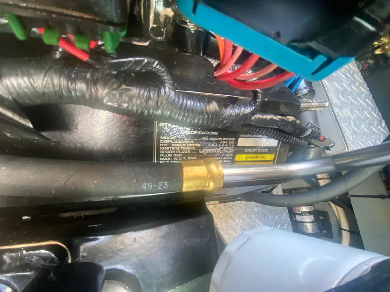 Slide: The Image of Engine compartment of a 1999 Sea Ray 380 Sundancer with visible wiring and specifications label. - 40