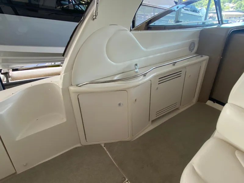 Slide: The Image of Interior view of a 1999 Sea Ray 380 Sundancer yacht, featuring a sleek storage area. - 9