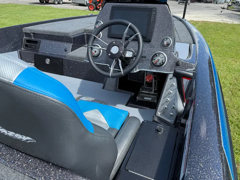 Slide: The Image of Interior of 2026 Blazer 650 NAP boat with steering wheel and control panel. - 14