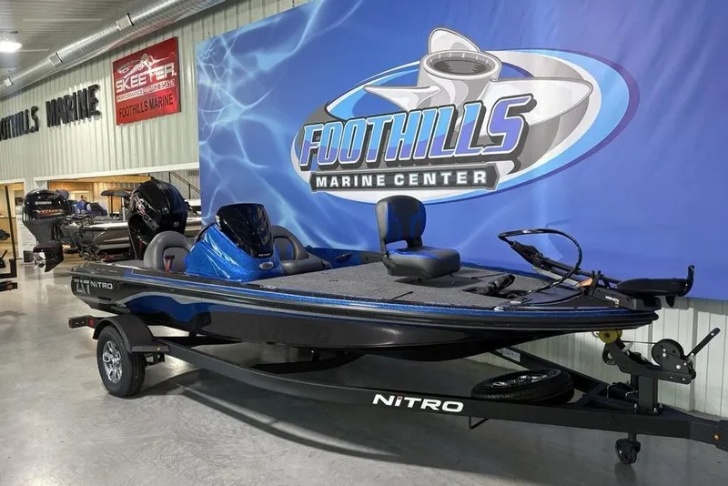 Slide: The Image of 2026 Nitro Z17 boat displayed at Foothills Marine Center showroom. - 11