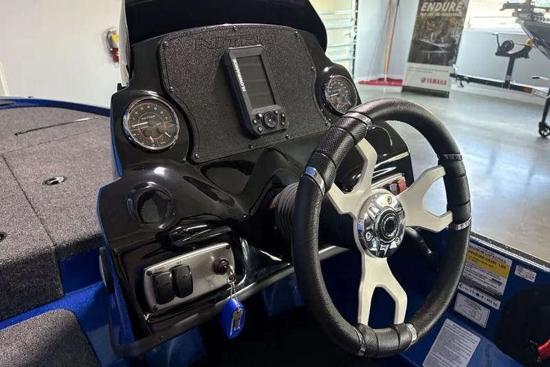 Slide: The Image of Steering console of a 2026 Nitro Z17 boat with modern gauges and controls. - 13