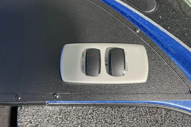 Slide: The Image of Control panel of 2026 Nitro Z17 boat with switches for anchor light and trim adjustment. - 16