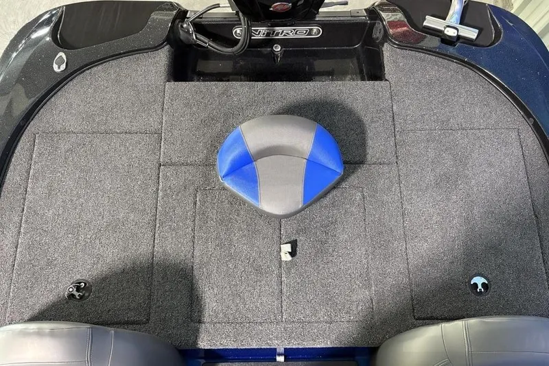 Slide: The Image of 2026 Nitro Z17 boat deck with gray carpet and blue-gray seat. - 20