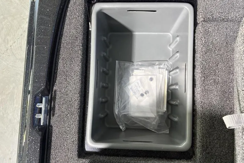 Slide: The Image of Storage compartment in 2026 Nitro Z17 boat with packaged items inside. - 25